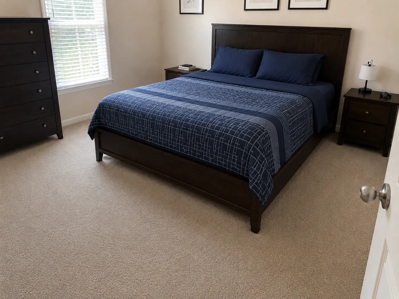 Guest bedroom with the bed freshly made after a short-term rental turnover